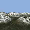 Mountainous Terrain With Snow Covered Peaks And Green Forested Valleys