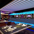 Modern Bar Featuring Neon Lighting Bar Counter Wine Cabinets High Stools Colorful Lights Decorative Paintings