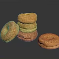Golden Brown Sesame Seed Bagels Stacked and Single on Black Surface