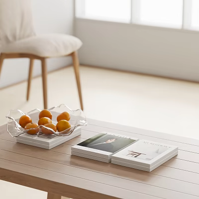 Modern Decorative Ornament Set With Glass Fruit Bowl Orange Fruits White Books On Wooden Table 3d model