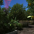 Garden Landscape Featuring Orange Trees Banana Plants And Pink Tower Under Blue Sky