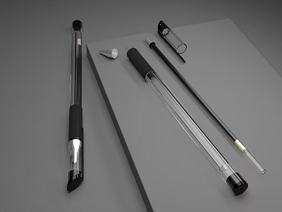 Sleek Black And Clear Pens With Matching Caps On Gray Notebook Surface 3d model