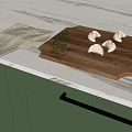 Fresh Dumplings on Wooden Cutting Board with Decorative Leaf and Checkered Cloth in Kitchen
