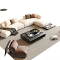 Beige L Shaped Sofa And Black Coffee Table Set With Cushions Throw Blanket And Books