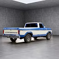 Classic Blue And White Pickup Truck Parked In Gray Interior Space