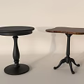 Two Round Tables With Different Designs Black Brown Tops And Unique Bases For Home Decor