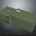 Two Green Cardboard Boxes With Tape Sealed And Label On Surface