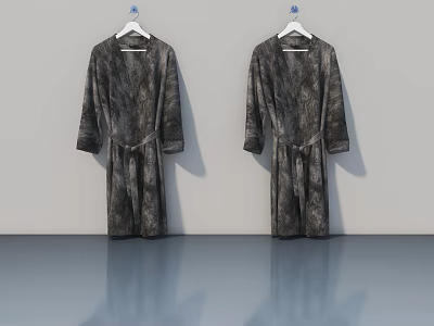 Two Long Sleeved Patterned Robes Hanging On White Hangers With Belt 3d model