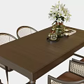 Brown Wooden Dining Table Set With Wicker Back Chairs Brown Cushions White Flowers And Candles