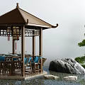Traditional Garden Pavilion With Wooden Tiered Roof Blue Cushioned Chairs Rock Water And Pine Tree