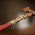 Old Rusted Axe With Worn Wooden Handle And Red Grip As Historical Weapon