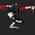 Woman Doing Inverted Breakdancing Pose With Black Crop Top Green Pants Red Leg Warmers Sneakers