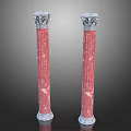 Two Red Marble Roman Columns With Ornate Carved Capitals And Classic Design