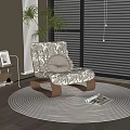 Patterned Rocking Sofa Chair with Shelved Coffee Table on Circular Rug and Plants by Window