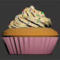 Household Dessert Cupcake With White Cream And Colorful Sprinkles In Pink Paper