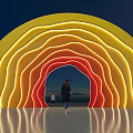 Colorful Gradient Event Entrance With Yellow Orange Red Lights And People Walking Through