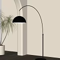 Black Arched Floor Lamp With Dome Shade And Plant Near Light Colored Wall