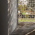 Architectural Exterior Wall With Geometric Lattice Design Gray Walls Wall Lamps And Light Shadow Effects
