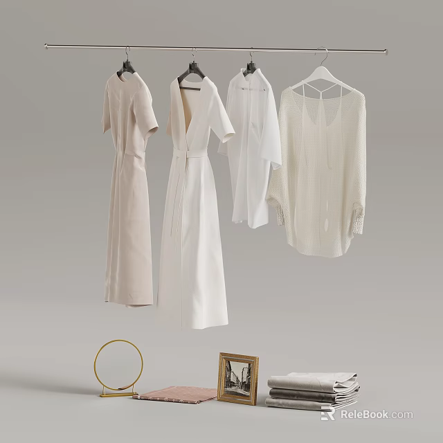 White Dresses And Shirts Hanging With Decorative Mirror Photo Frame And Folded Fabric 3d model 