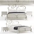 Elegant Double Bed With Curved Metal Headboard White Bedding Dark Blanket And Bedside Tables