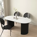 Oval White Marble Dining Table with Black Striped Legs and Black Chairs in Modern Interior