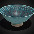 Turquoise Ceramic Bowl Featuring Intricate Decorative Patterns And Light Colored Base