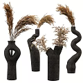 Black Ceramic Vases With Unique Curved Shapes Holding Dried Pampas Grass Decorative Pieces