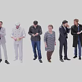 Diverse Group of People Standing Together in Various Outfits and Poses