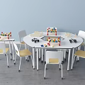 Round Table And White Chair Set With Yellow Seats Building Blocks In Kids Play Area