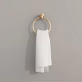 White Towel Hanging On Gold Towel Ring Against Gray Wall