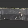 Old Two Story Building With Weathered Brown Facade Dark Roof Chimneys And Windows