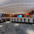 Spacious Modern Conference Room With Rows Of Seats Large Screen And Curved Ceiling
