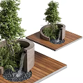Tree Planter with Green Trees and Plants on Wooden Deck with Small Waterfall and Pebbles