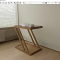 Minimalist Wooden Side Table by the Window with Stacked Books