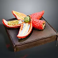 Colorful Decorative Starfish Ornament With Red Yellow Green Petals On Brown Box