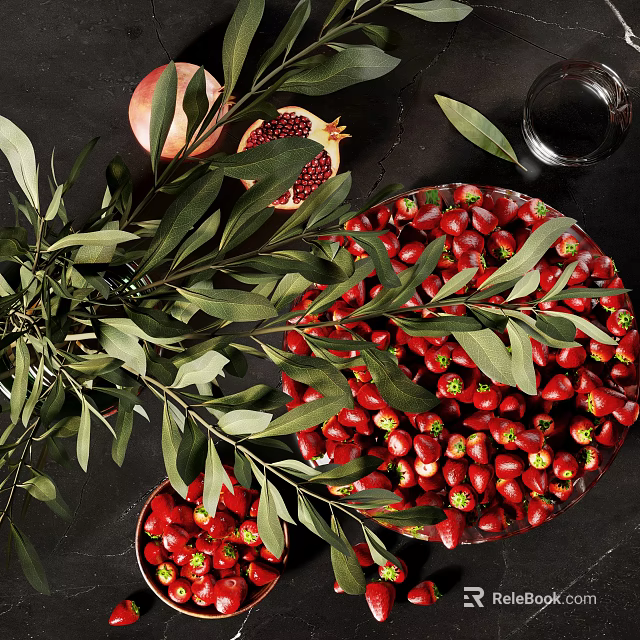 Sliced Pomegranate And Red Fruits Arrangement With Olive Leaves On Dark Table 3d model 