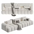 Modern Three Seater Sofa in Gray and White with Plush Pillows and Blanket