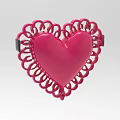 Pink Heart Shaped Decorative Item With Intricate Lace Like Border Design