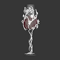 Decorative Wine Glass With Intricate Patterns And Red Liquid In Transparent Base
