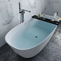 White Freestanding Bathtub In Modern Bathroom With Marble Wall Wooden Stool And Toiletries