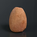 Carved Brown Oval Sculpture With Rough Surface On Dark Reflective Background 3d model