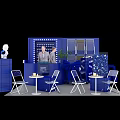 Modern Blue Exhibition Booth Setup with Staff White Tables Chairs Display Cabinets and Plants