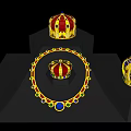 Golden Crowns And Necklace With Red Blue Green Gems On Black Display Stands