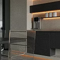 Modern Restaurant Dining Area With Open Concept Black Cabinets Clear Chairs And Lighting