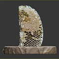 Natural Honeycomb Structure Placed On Round Stone Base With Golden Honey