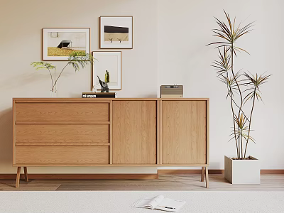 Modern Wooden Sideboard With Framed Art Decorative Items And Potted Plants 3d model