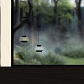 Modern Pendant Lights With Domed Amber And Smoke Shades Against Natural Forest View