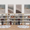 Various Shoes Displayed on Golden Metal Shelves With Coastal Wall Art and Round Rugs