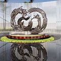 Sleek Metallic Wave Sculpture on Red Pedestal with Green Lawn Floor Reflection