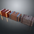 Three Vintage Wooden Trunks With Different Colors And Metal Decorative Straps